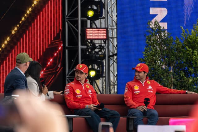 People Couch Microphones Hats Red Blue Green Stage Lights Trees Screens Conversation Event