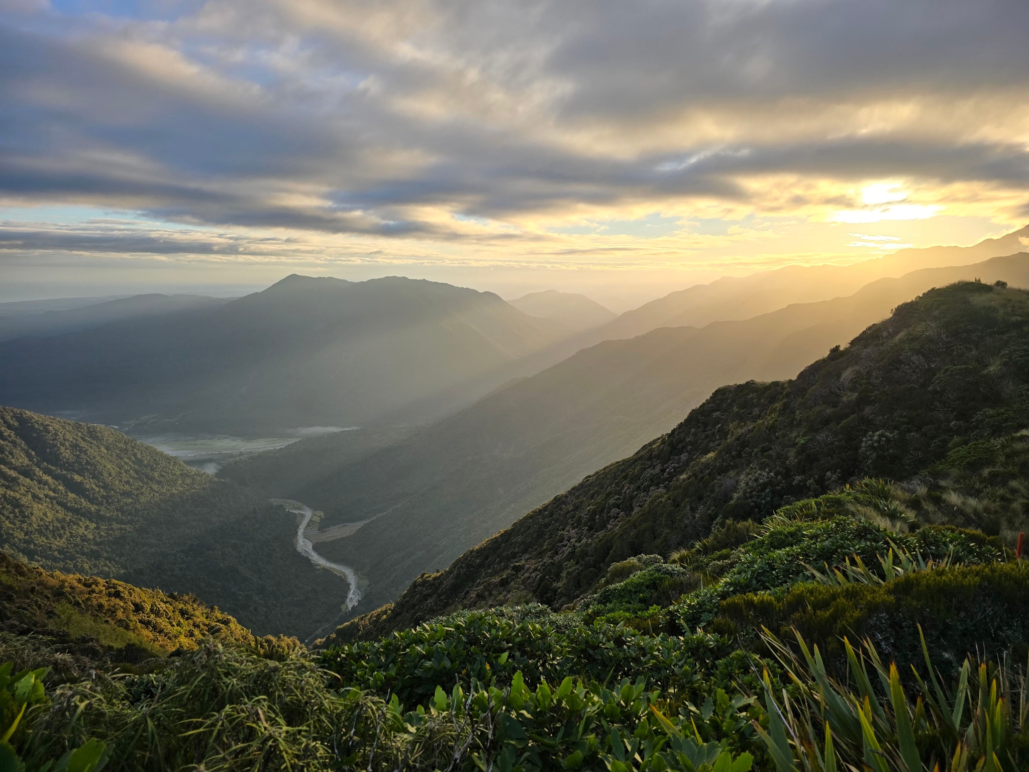 mountains hills valley river sky clouds sunrise sunset sunlight landscape nature greenery vegetation horizon scenic view panorama outdoor wilderness serene peaceful tranquil blue green yellow