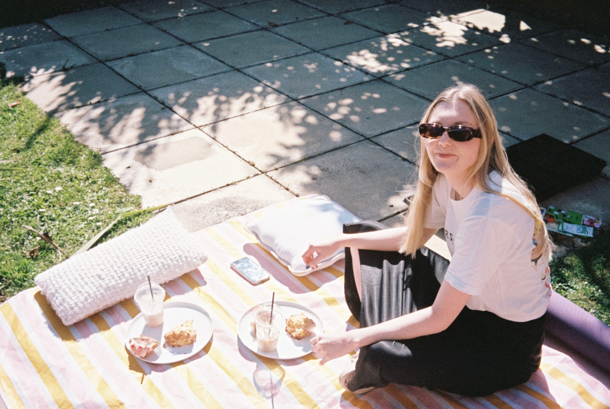 Picnic Blanket Sunglasses Plates Food Grass Patio Shadow Sunlight Outdoor White Stripes Pillow Glasses Woman Sitting Relaxing Summer Daylight Casual Meal Leisure Garden Green Yellow Black Striped Mat