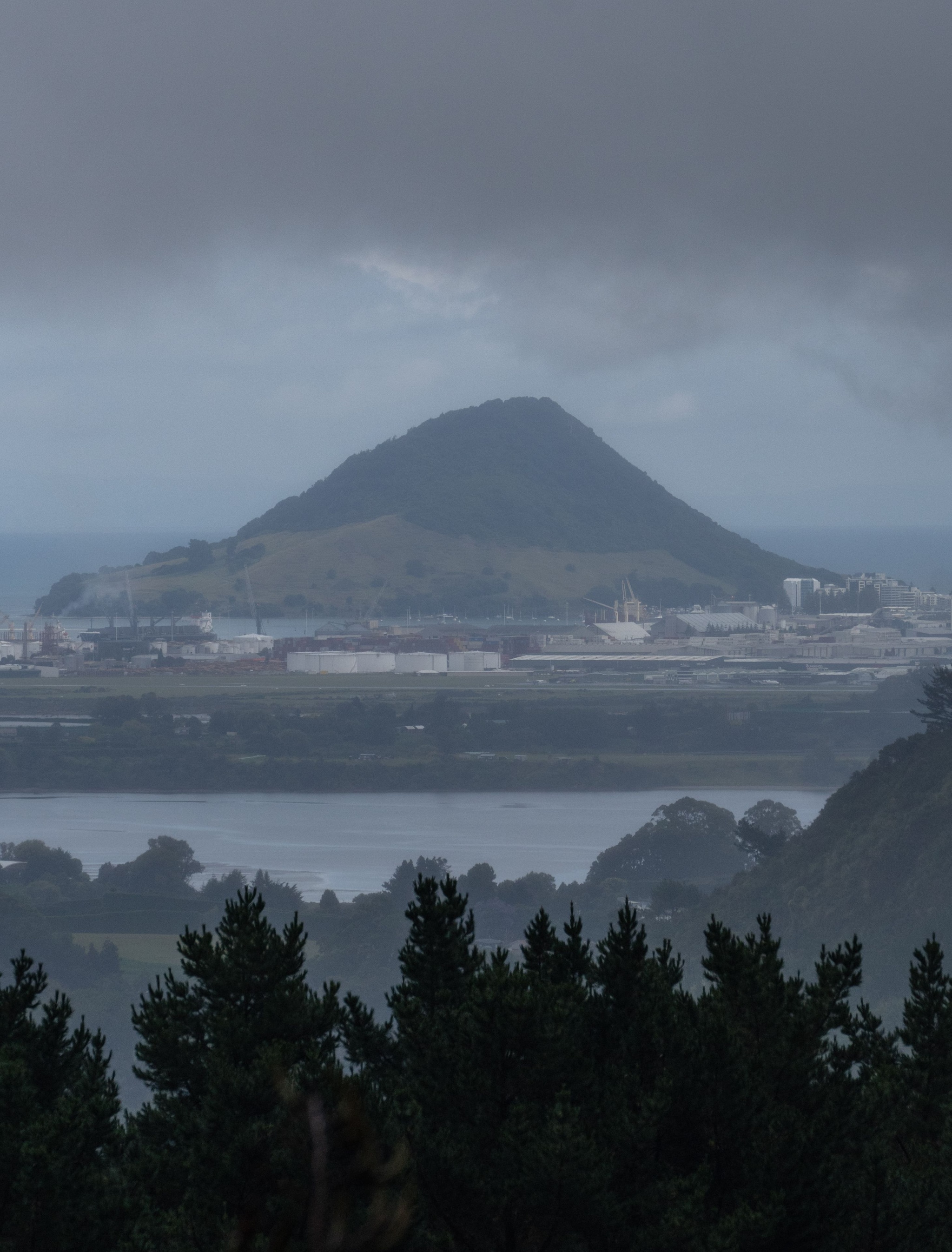 Mountain Hill City Buildings Trees Water Cloudy Sky Overcast Landscape Nature Green Gray Blue Distant View Horizon Forest Vegetation Scenery Outdoors Urban Area Coastline Island Silhouette Skyline Background Environment Tranquil Calm Peaceful